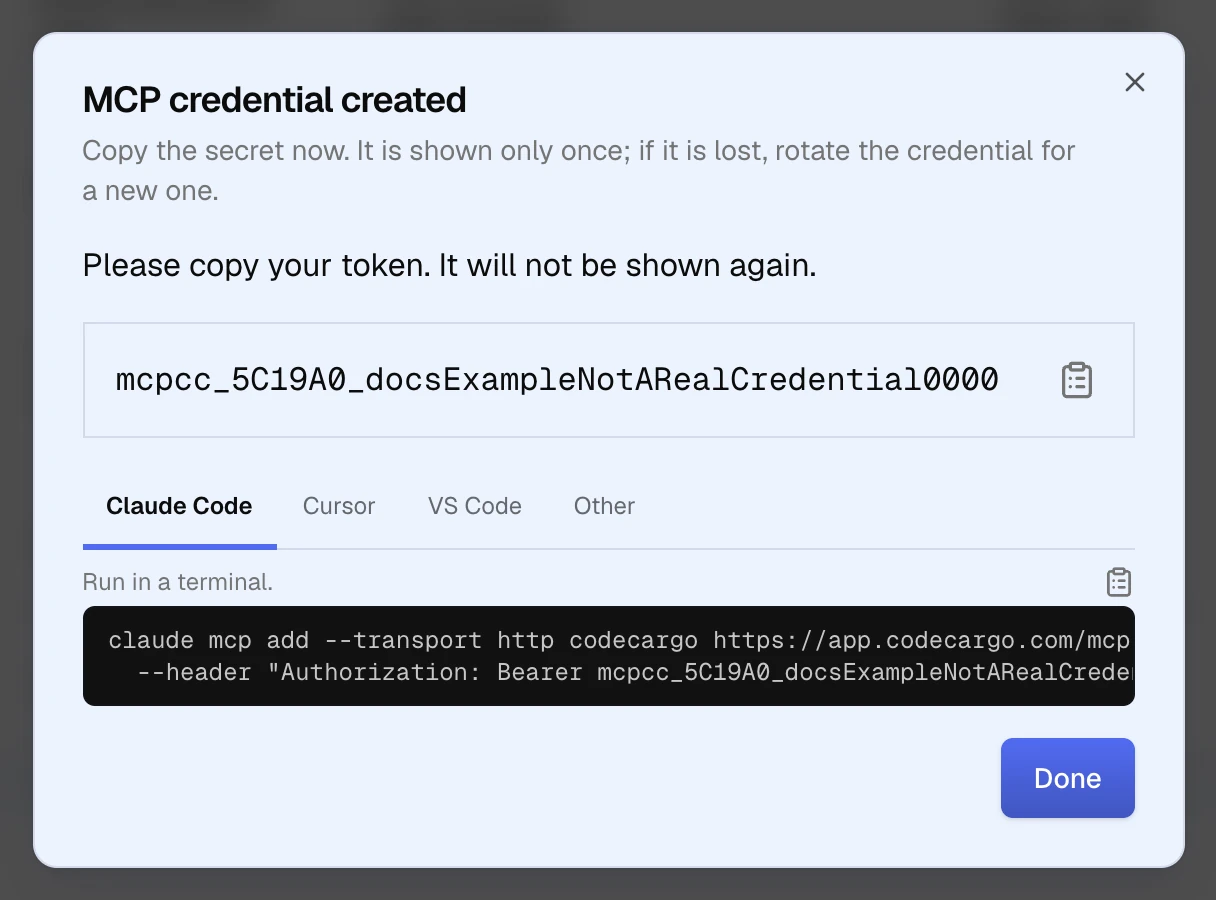 The MCP credential created dialog: a note to copy the secret now, the secret with a copy button, and Claude Code, Cursor, VS Code and Other tabs, with the Claude Code command that adds CodeCargo's MCP endpoint using the secret as a bearer token